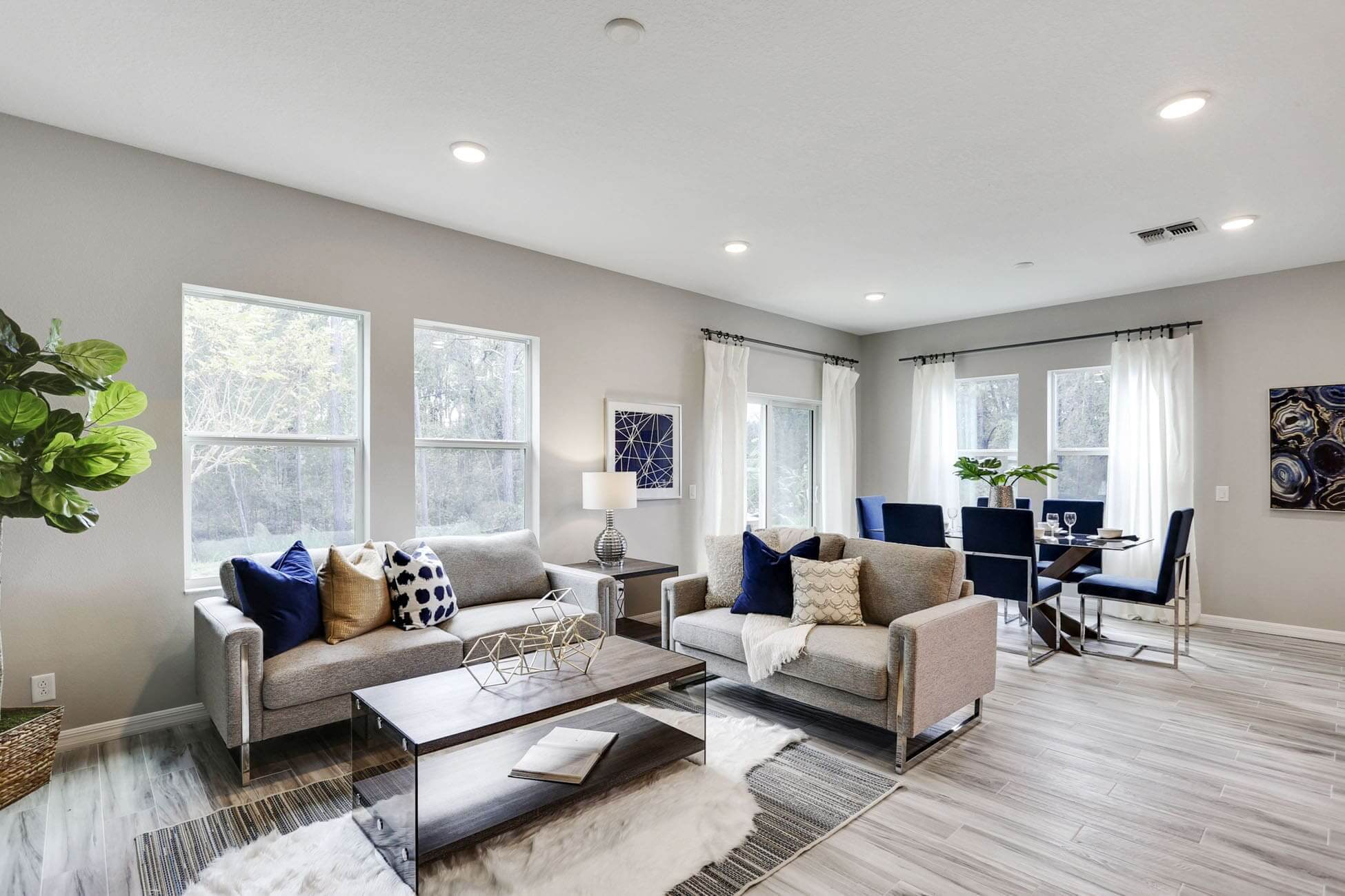 Modern living room with gray sofas and decor.